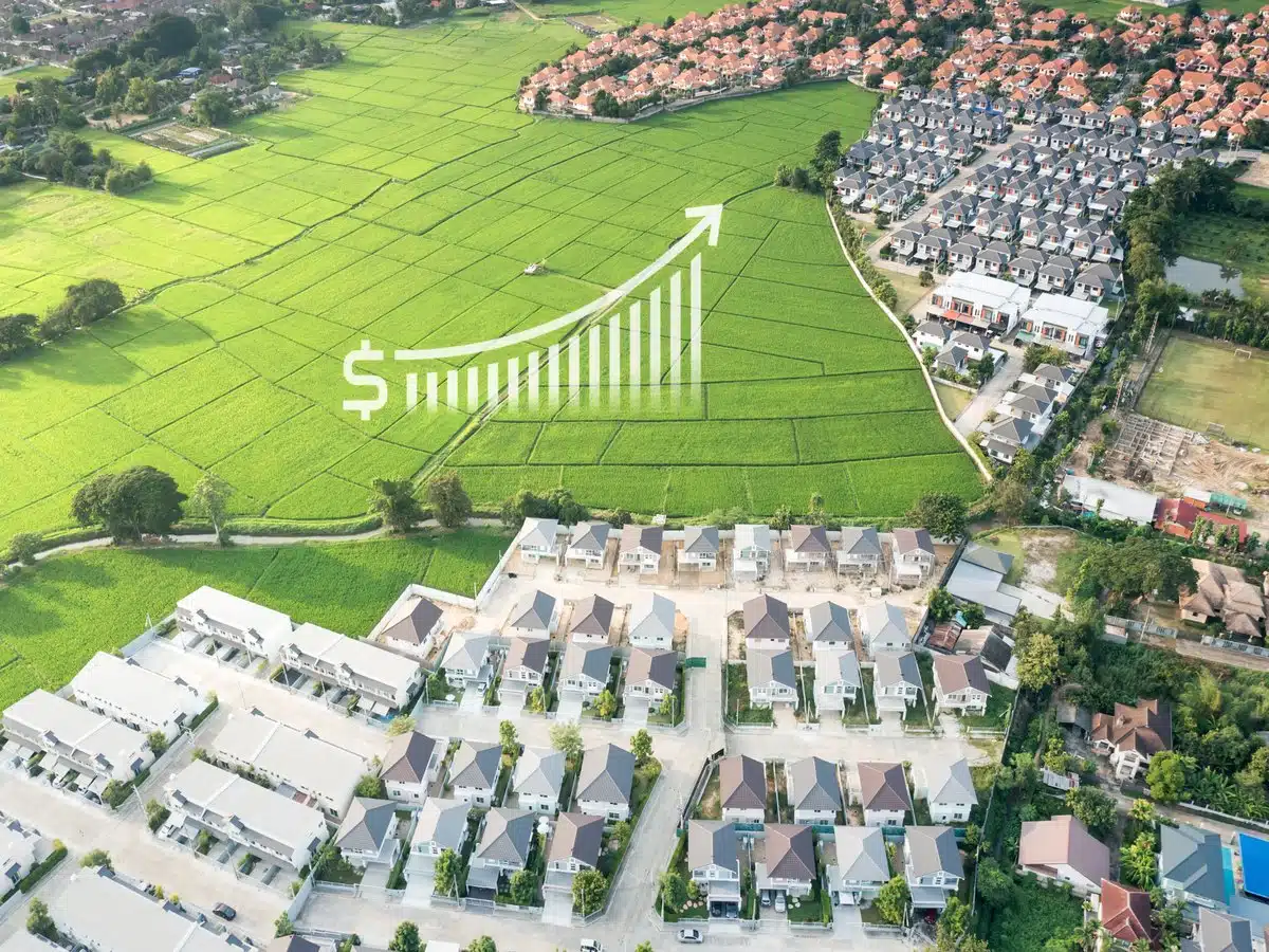 Aerial view of a suburban neighborhood near open green fields in one of the best areas to live in Denver Colorado.